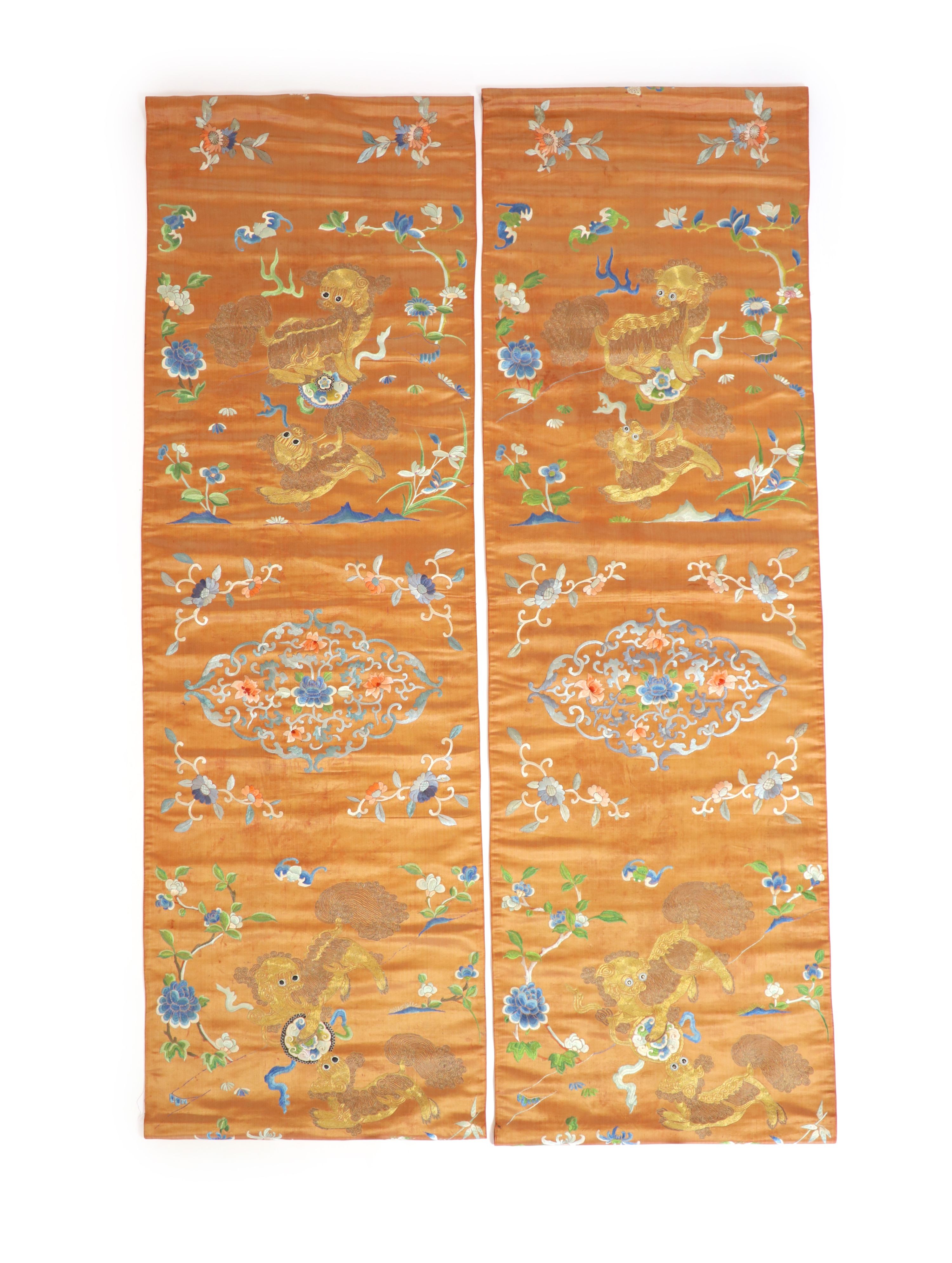 A pair of Chinese peach silk embroidered hangings, 19th century 137 x 44 cm